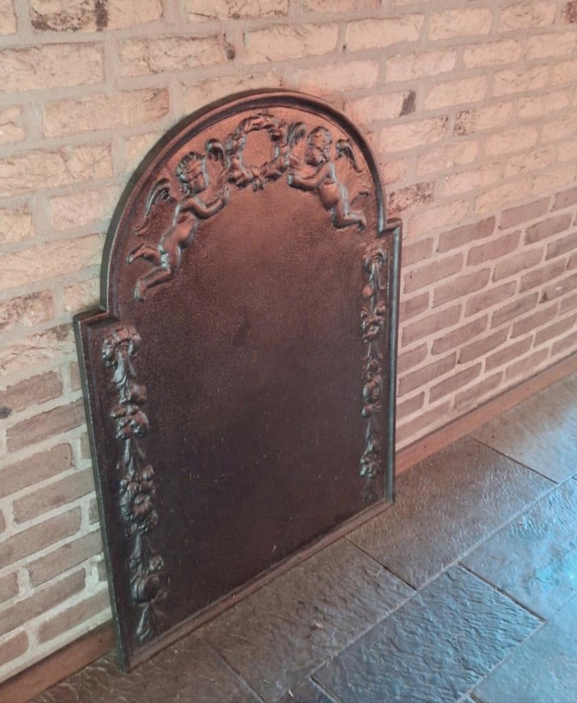 Antieke gietijzeren haardplaat met engeltjes, Antiek en Kunst, Ophalen of Verzenden