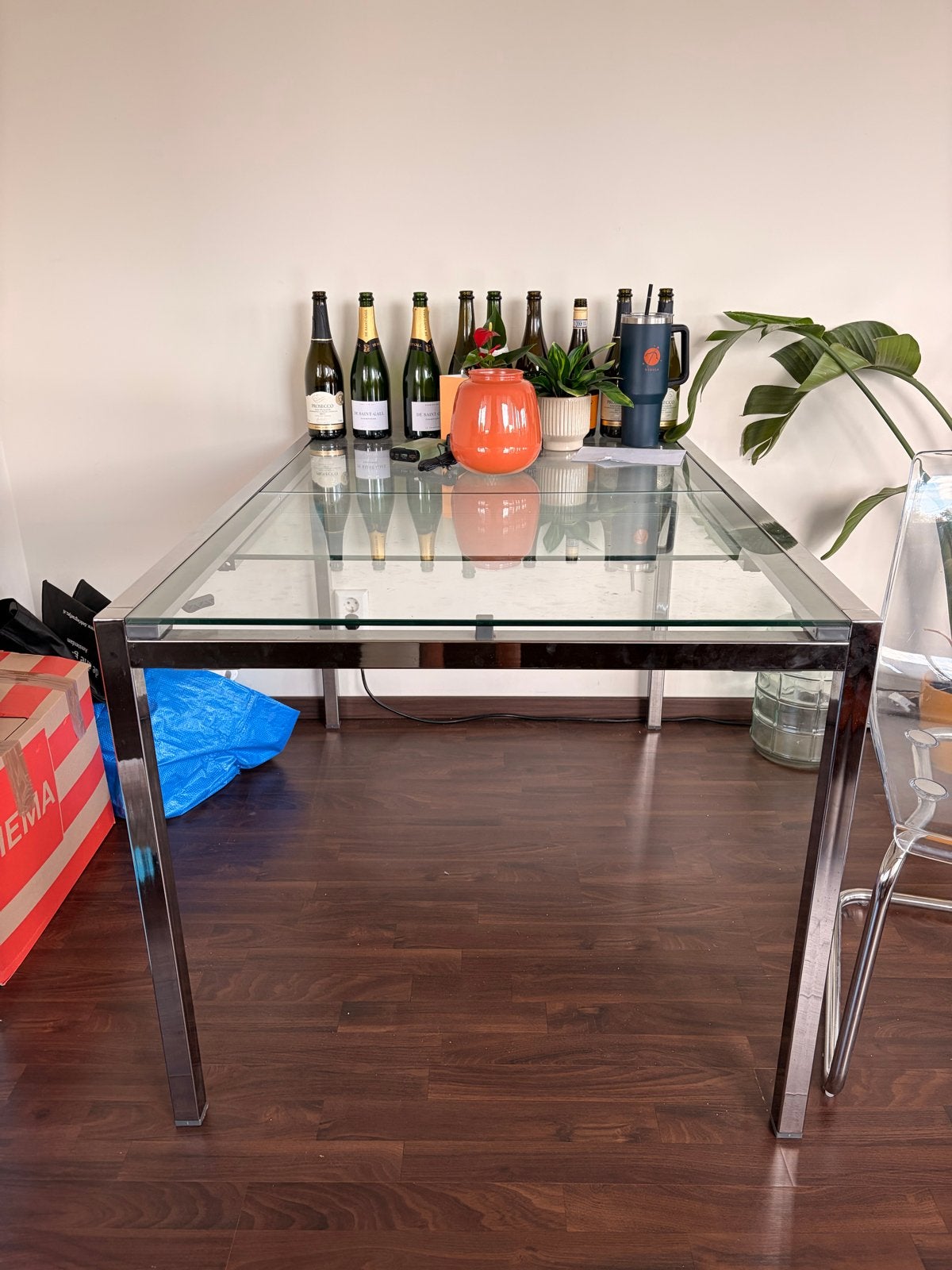 Uitschuifbare eettafel met glazen blad en metalen onderstel, Huis en Inrichting, Ophalen, Gebruikt, 100 tot 150 cm, 50 tot 100 cm