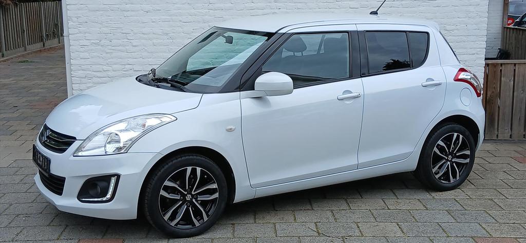 SUZUKI Swift 1.2 VVT 5drs stijl ,cruise ,airco,lmv 58000 km, Auto's, Suzuki, 945 kg, Stoelverwarming, Gebruikt, 4 cilinders
