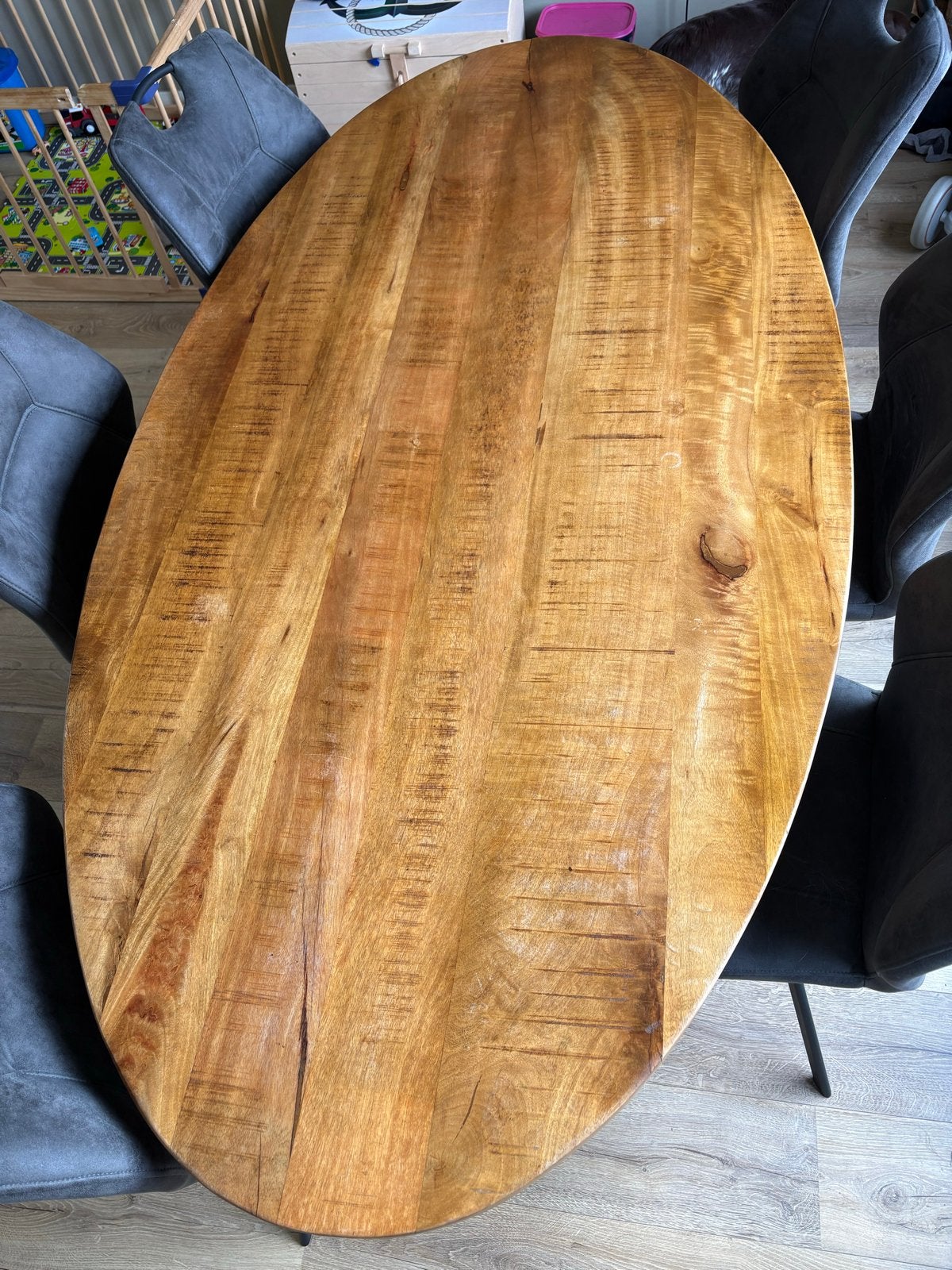 Ovale mangohouten eettafel met stalen kruispoot, Ophalen, 50 tot 100 cm, Zo goed als nieuw, Vijf personen of meer