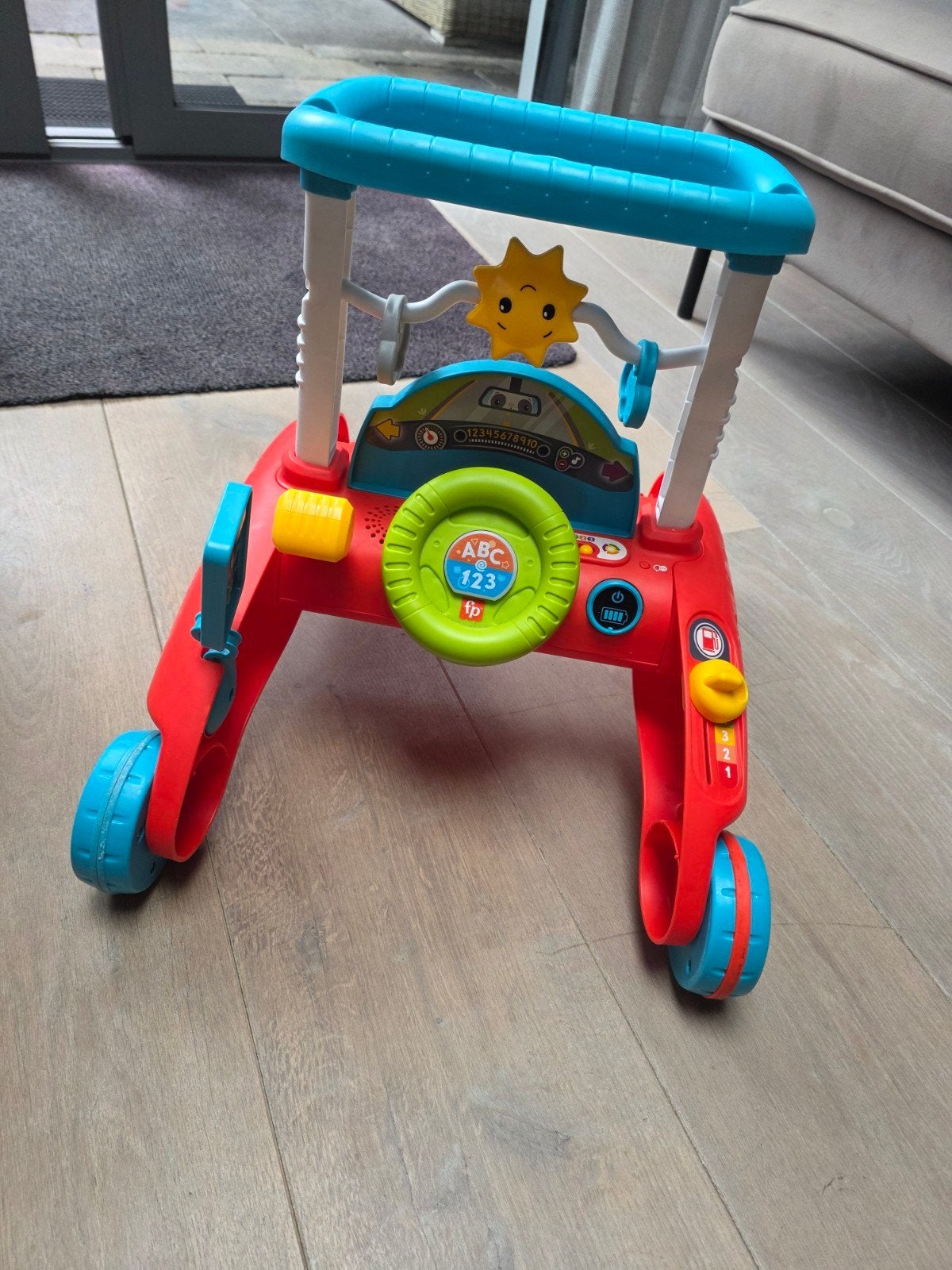 Fisher-Price tweezijdige loopwagen met geluid en blokken, Ophalen