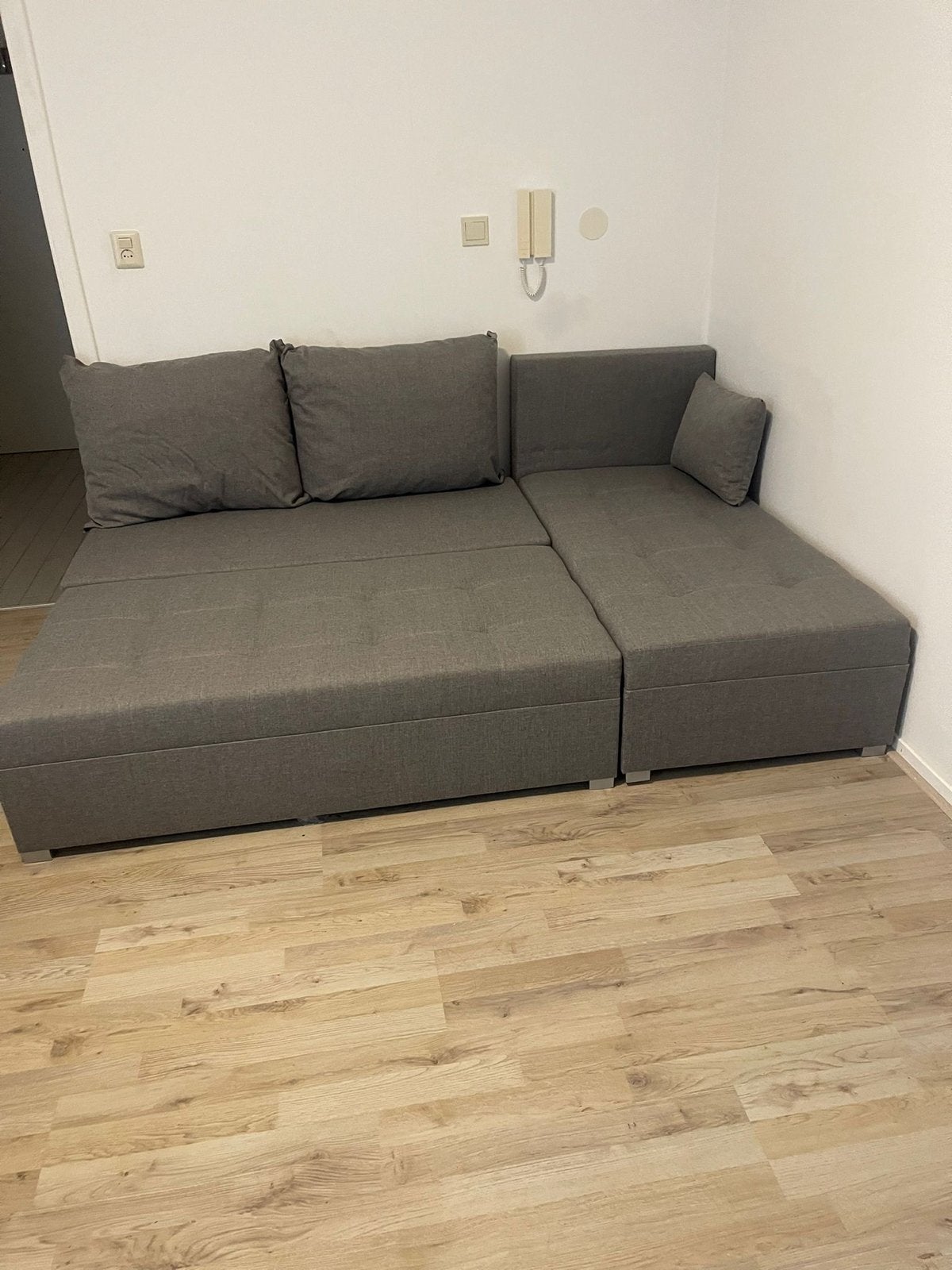 Grijze slaapbank met opbergruimte, Ophalen, 125 tot 150 cm, Hoekbank, Stof