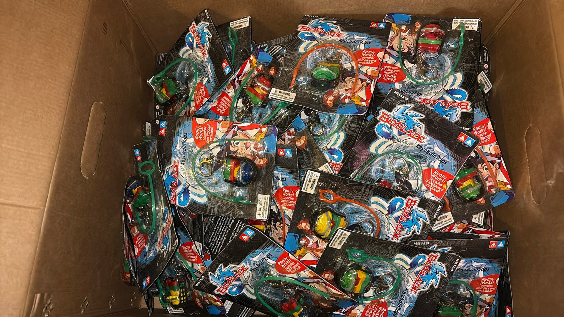100 Beyblade sleutelhangers, Ophalen of Verzenden, Gebruikt