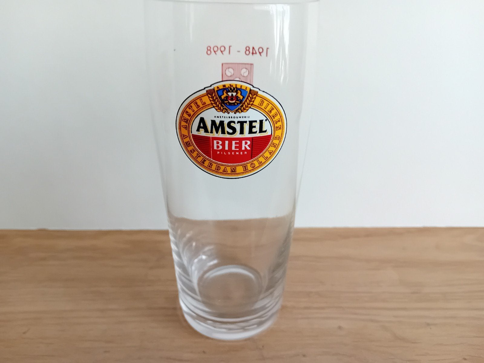Amstel glas nummer 9 met achteropdruk, Verzamelen, Ophalen of Verzenden, Zo goed als nieuw, Glas of Glazen, Amstel