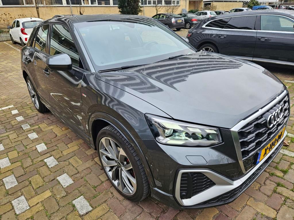 Audi Q2 35 Tfsi 150pk S Tronic 2023 Grijs, Auto's, Audi, 15 km/l, 4 cilinders, Origineel Nederlands, 690 kg