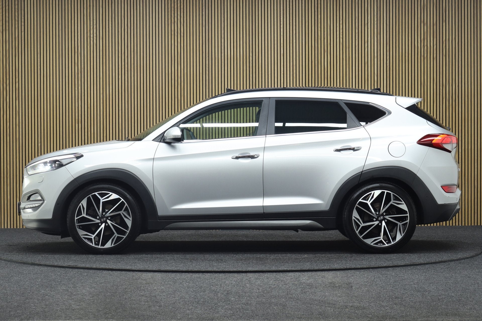 Hyundai Tucson 1.6 T-GDi Premium 4WD | Elek. Glazen Panorama, Auto's, Gebruikt, 4 cilinders, Leder, Bedrijf