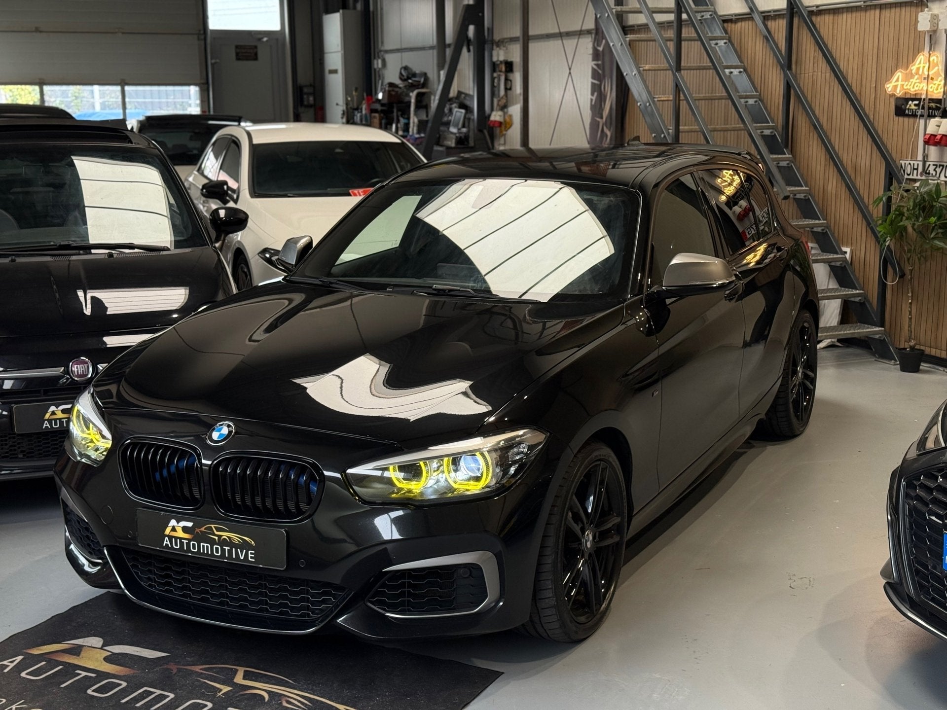 BMW 1-serie M140i xDrive High Executive Harman/Kardon, Auto's, Gebruikt, Euro 6, Leder, Bedrijf