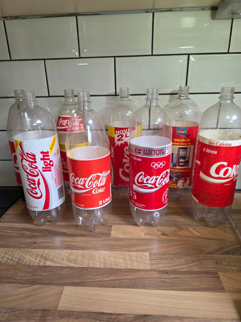 8 Vintage Coca-Cola 2L flessen - Diverse edities, Ophalen of Verzenden, Gebruikt, Overige typen