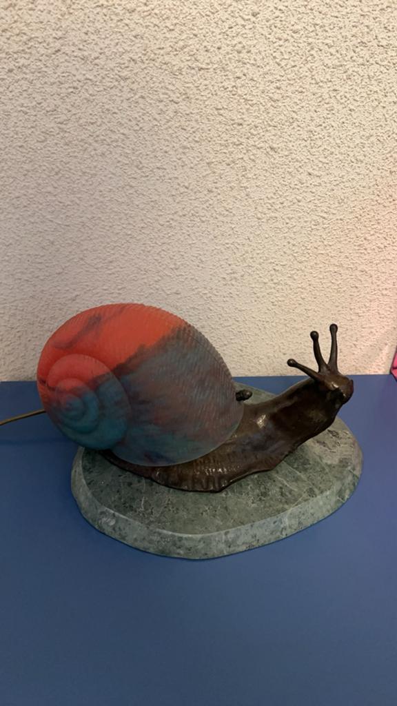 Bronzen slakkenlamp, Ophalen