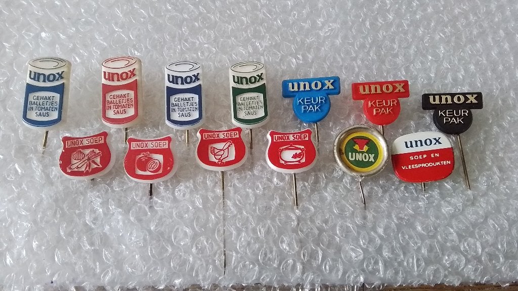 13 verschillende speldjes unox, Verzamelen, Ophalen of Verzenden, Zo goed als nieuw, Overige onderwerpen