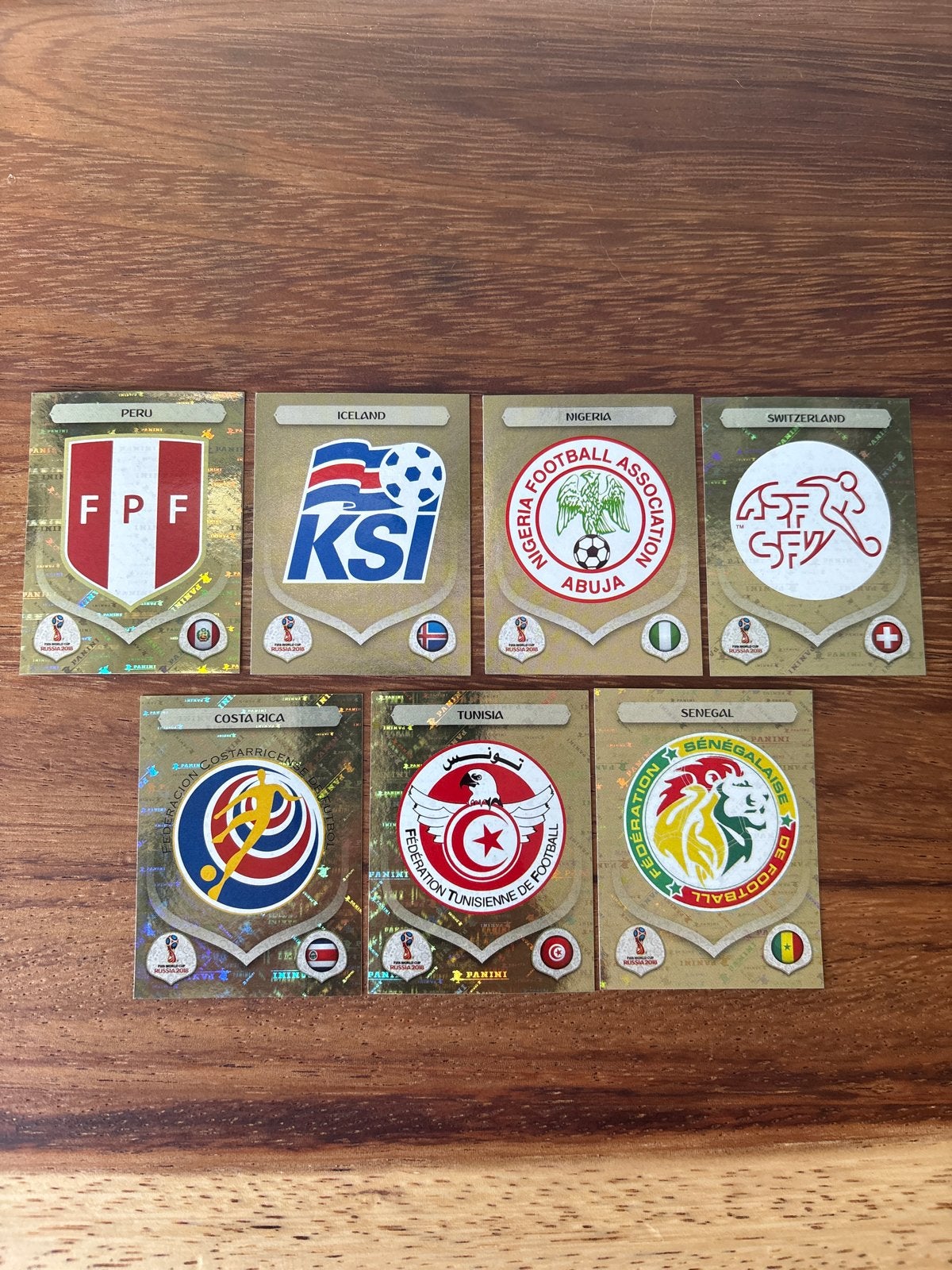 Panini WK 2018 Rusland Gouden Emblemen (7 stuks), Ophalen of Verzenden, Nieuw, Stickers en Plaatjes