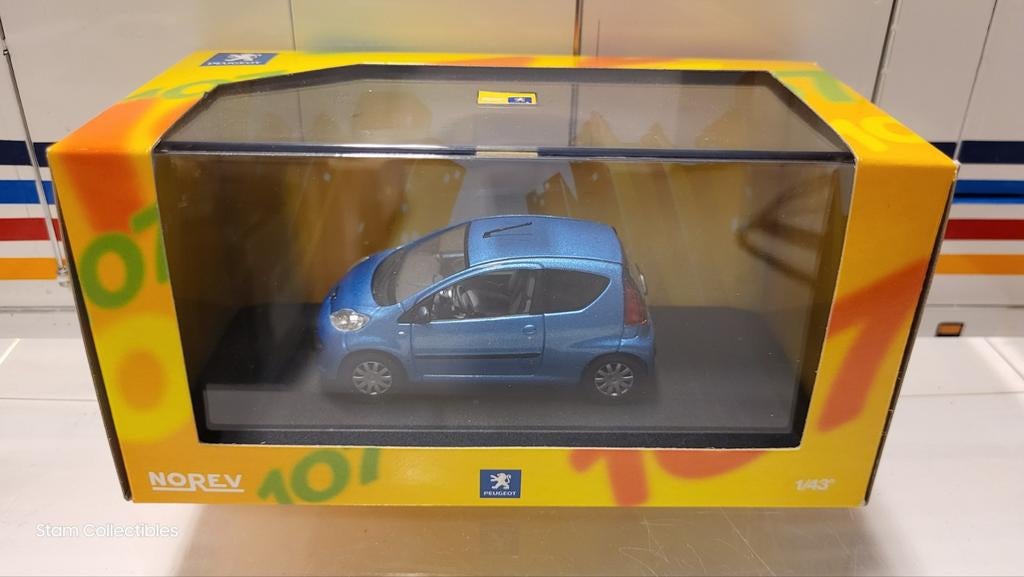 Norev Peugeot 107 3-deurs Blue Metallic, Hobby en Vrije tijd, Auto, Norev, Ophalen of Verzenden, Zo goed als nieuw