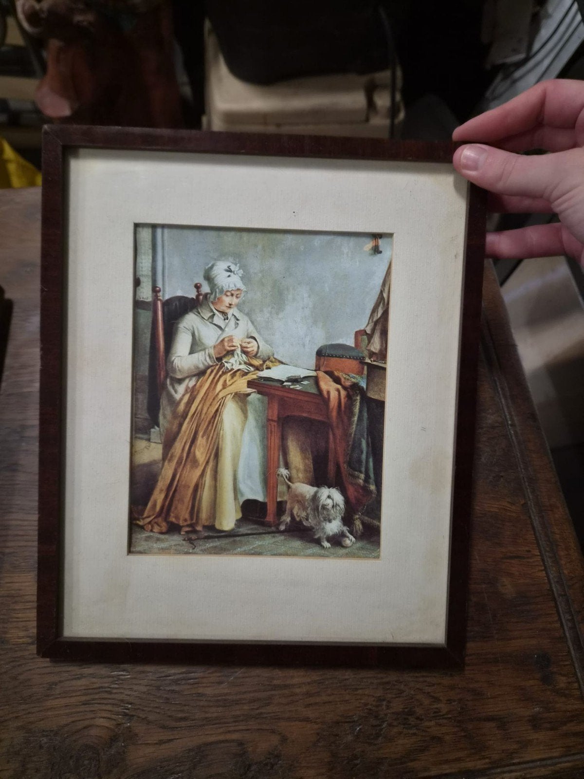 Klassiek schilderij: Vrouw aan het handwerken met hond, Ophalen
