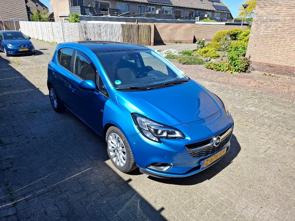 Opel Corsa 1.4 BENZINE AUTOMAAT blauw winterpakket dakraam, Auto's, Opel, 1063 kg, 4 cilinders, Blauw, Leder en Stof