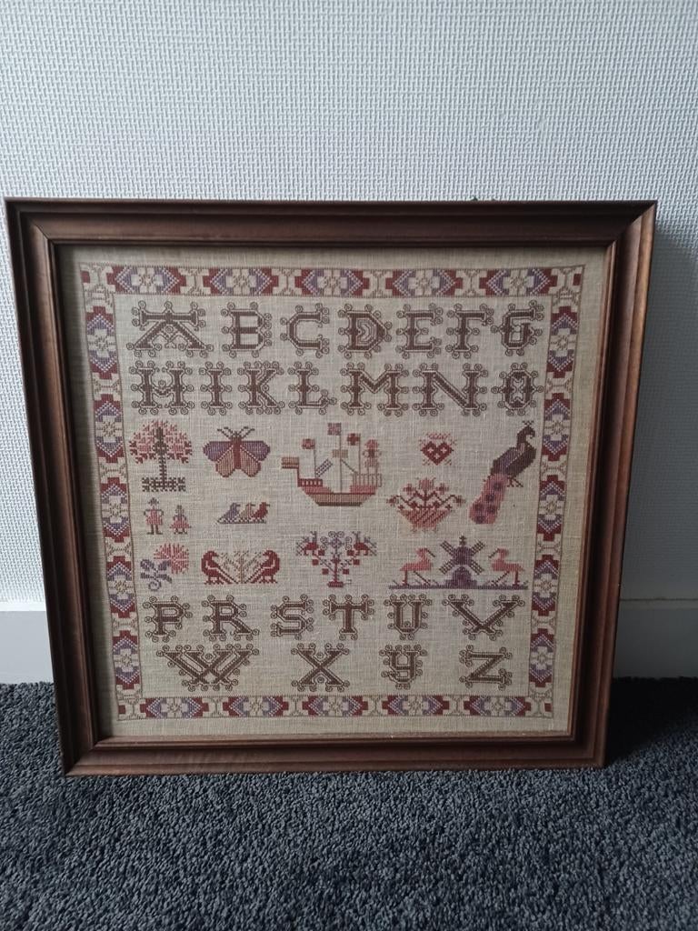 Oude merklap, handgeborduurd, ABC, Ophalen