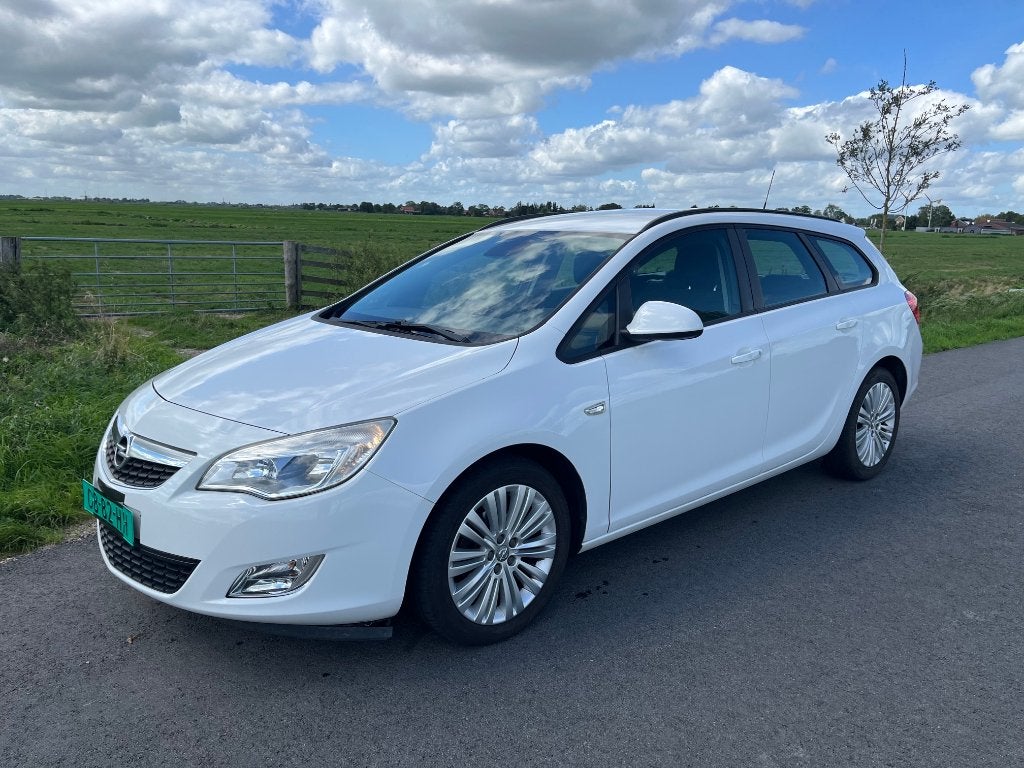 Opel Astra 1.3 CDTI Sports Tourer, Auto's, Opel, Voorwielaandrijving, Euro 5, Stof, Zwart
