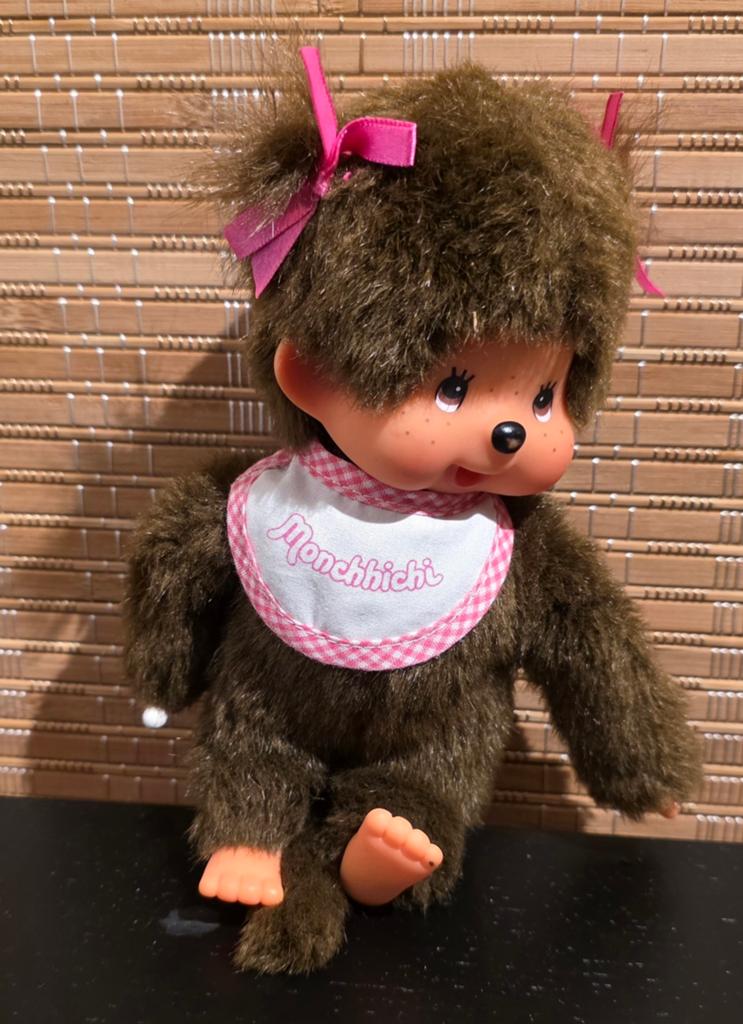 Monchhichi knuffel aapje met roze strikjes en slabbetje, Ophalen of Verzenden, Zo goed als nieuw