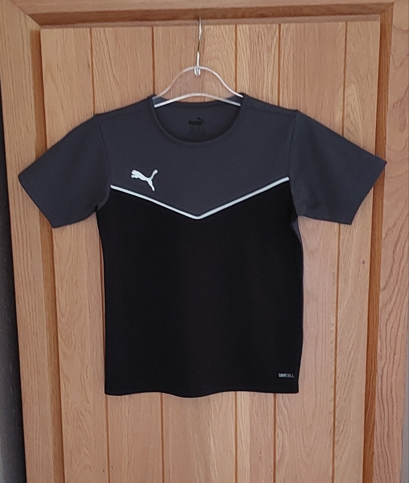 Puma sportshirt Zwart/Grijs - Maat 140, Kinderen en Baby's, Kinderkleding | Maat 140, Ophalen, Puma, Sport- of Zwemkleding, Zo goed als nieuw