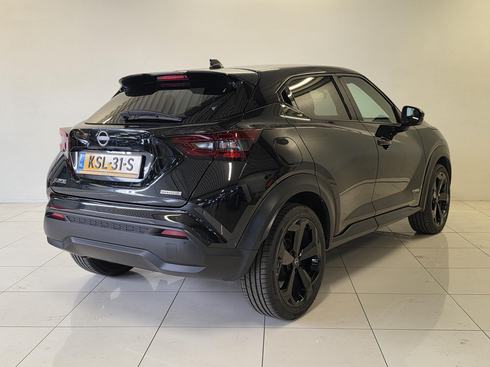 Nissan Juke 1.6 Hybrid Tekna | BOSE Audio | 360º Camera | S, Auto's, Dealer onderhouden, Gebruikt, Met garantie (alle), Leder en Stof