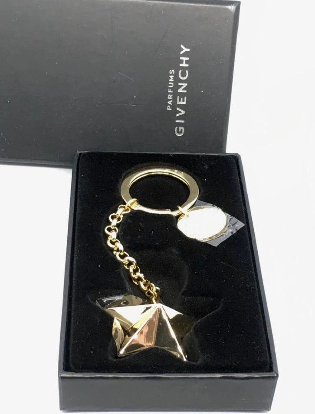 Mooie nieuwe sleutelhanger van Givenchy Parfums in doos, Ophalen of Verzenden, Nieuw, Merk
