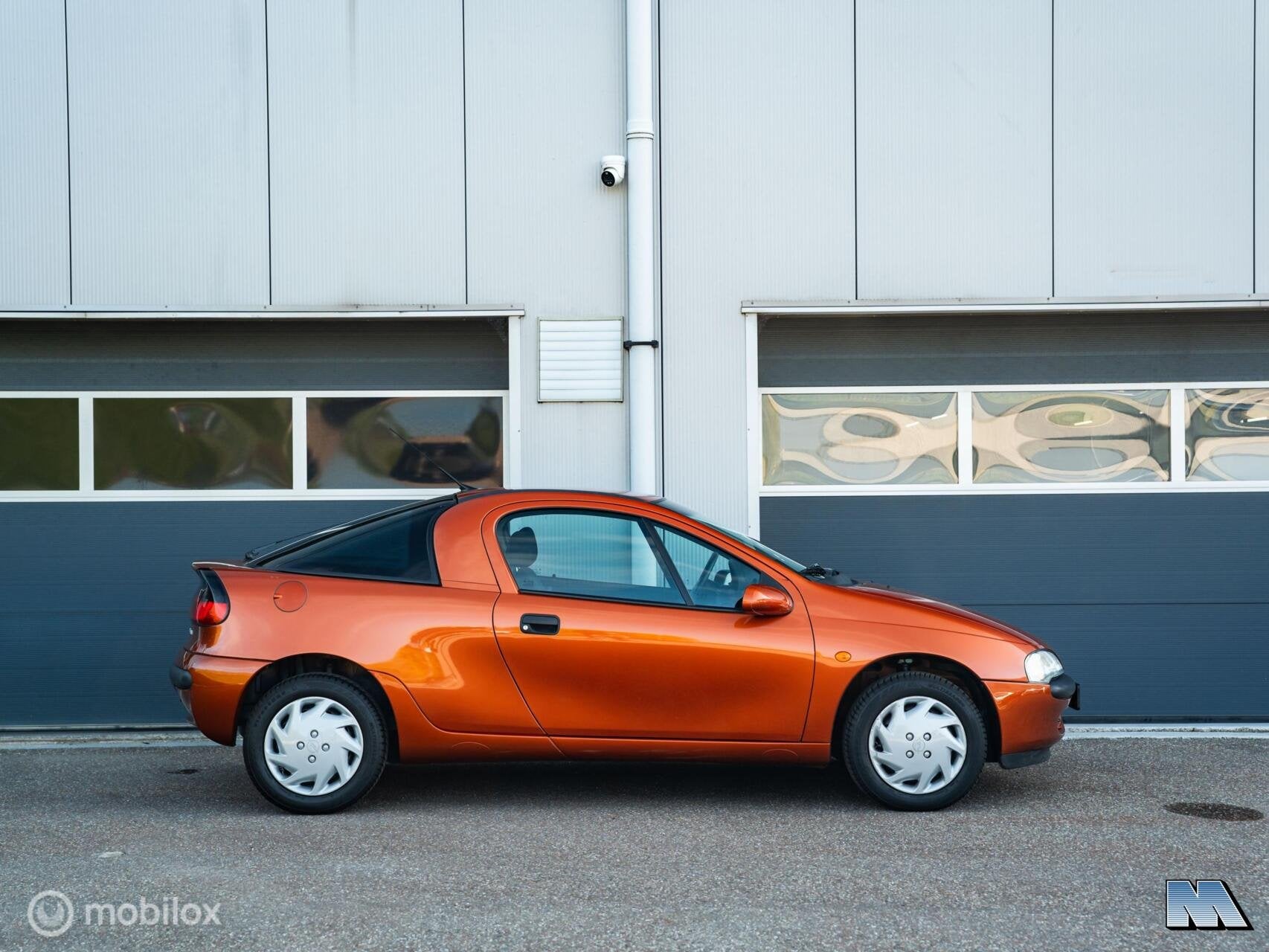 Opel Tigra 1.4i-16V | 1e eign. | Apache Metallic | ZGAN, Auto's, Opel, Voorwielaandrijving, Stof, Gebruikt, Zwart