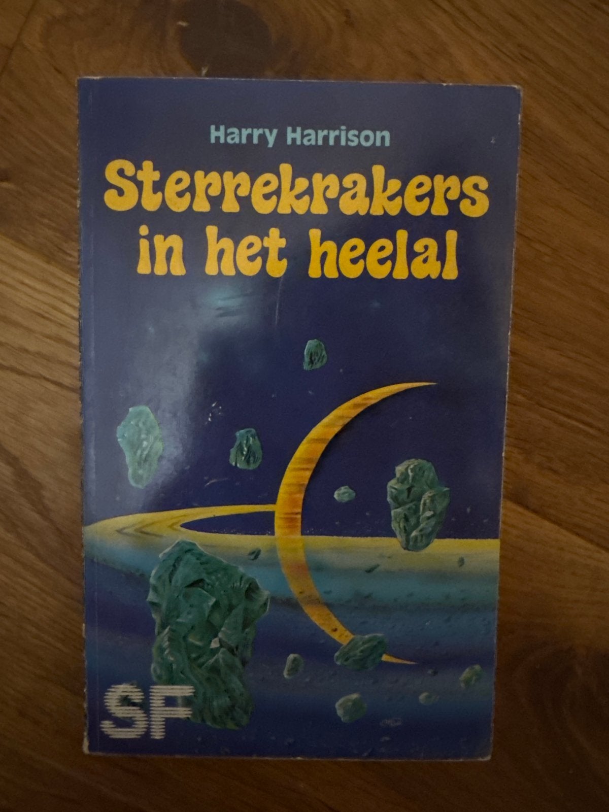 Sterrekrakers in het heelal - Harry Harrison SF Boek, Ophalen of Verzenden, Gelezen