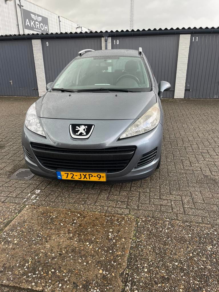 Peugeot 207  1.4 sw 95pk 2009 airco apk nieuw zeer netjes, Voorwielaandrijving, Origineel Nederlands, Handgeschakeld, Zilver of Grijs