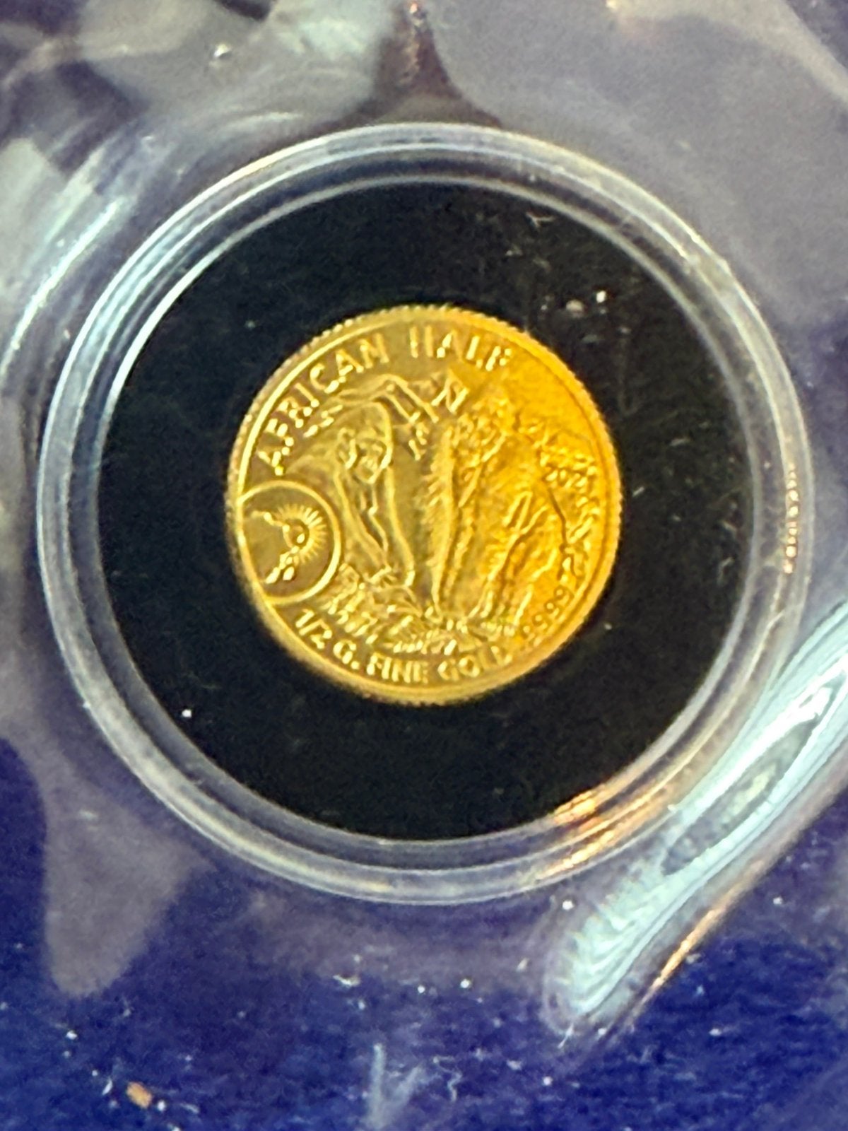 African half 0,5 gr goud. Gorrilla, Postzegels en Munten, Ophalen of Verzenden, Goud
