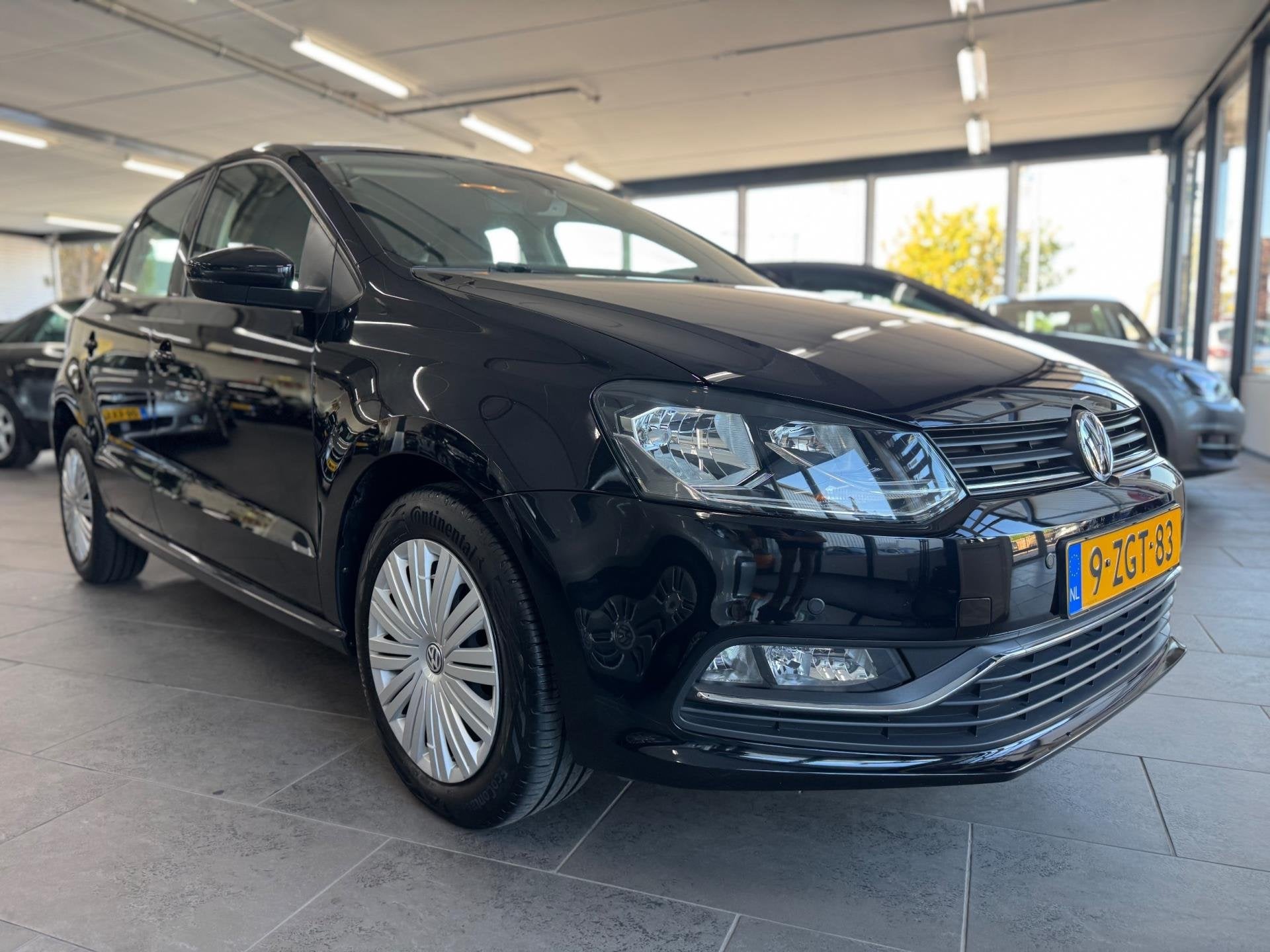 Volkswagen Polo 1.2 TSI Comfortline automaat Clima navigatie, Auto's, Stof, Gebruikt, Euro 6, 4 cilinders
