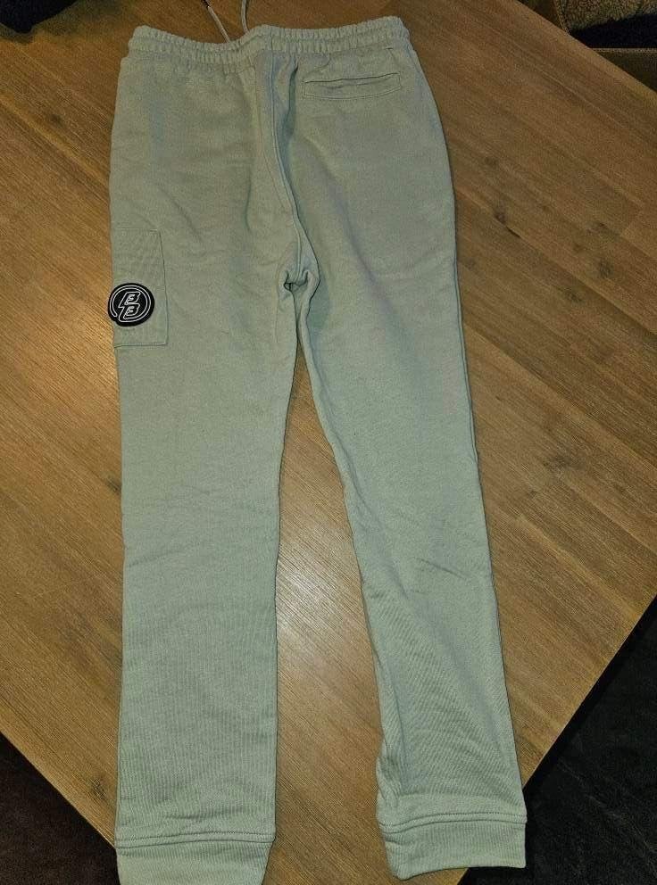 Stoere lichtgroene joggingbroek met logo maat 164, Broek, Meisje, Ophalen of Verzenden, Zo goed als nieuw