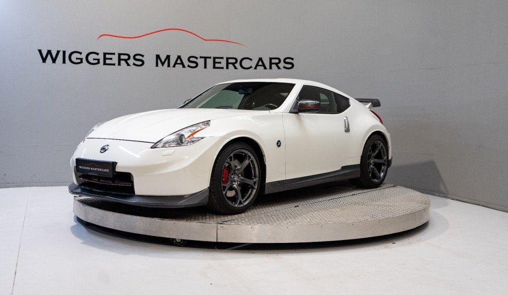 Nissan 370Z 3.7 V6 24V NISMO 344 PK Nr.313, Keyless, Bose so, Auto's, Gebruikt, Huisgarantie, Met garantie (alle), Wit
