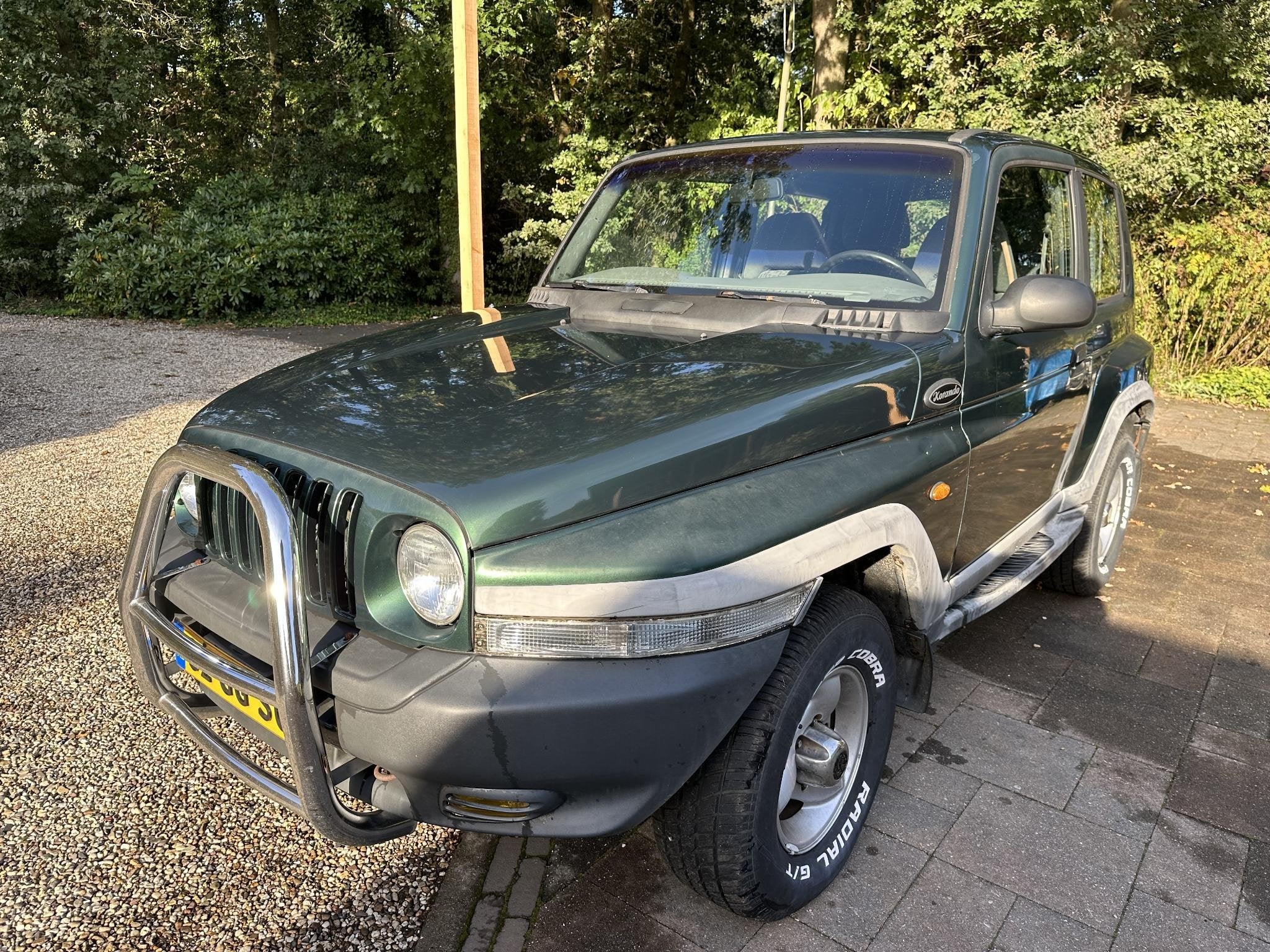 SsangYong Korando 2.3 E AWD 1e eigenaar, Auto's, Automaat, Stof, Gebruikt, Korando