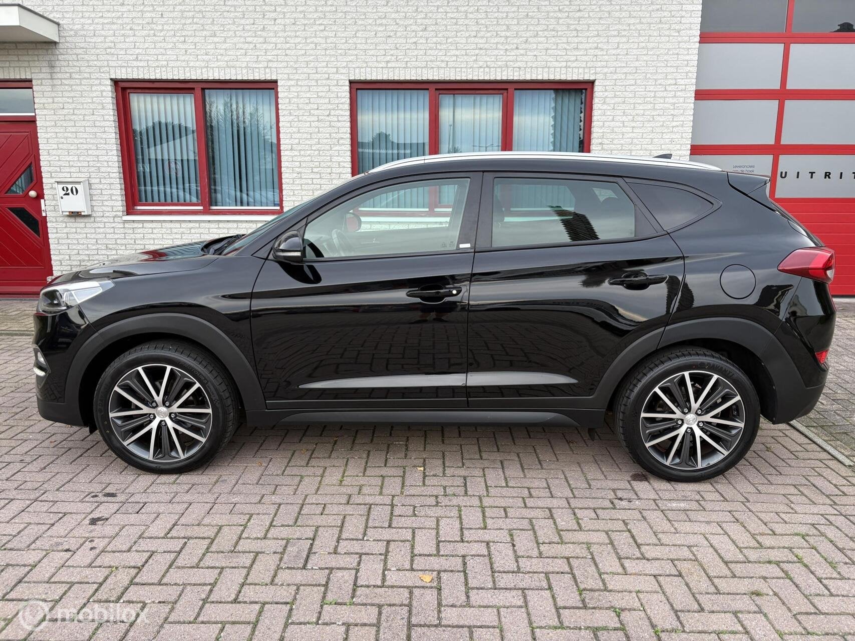 Hyundai Tucson 1.6 T-GDi Comfort 4WD NAVI/CAMERA/CRUISE, Auto's, Stof, Gebruikt, 4 cilinders, Zwart
