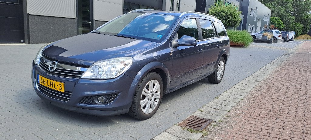Opel Astra 1.6 16V Cosmo 85KW St.wgn. 2010 Blauw, Voorwielaandrijving, 15 km/l, Zwart, Blauw