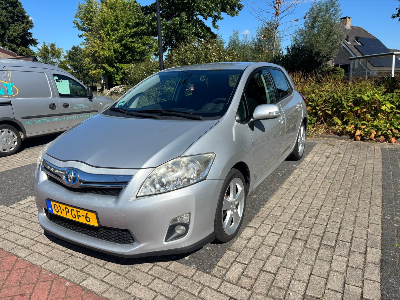 Toyota Auris 1.8 Full Hybrid 5DR CVT 2011 Grijs, Auto's, Toyota, Stof, Zwart, 4 cilinders, Origineel Nederlands