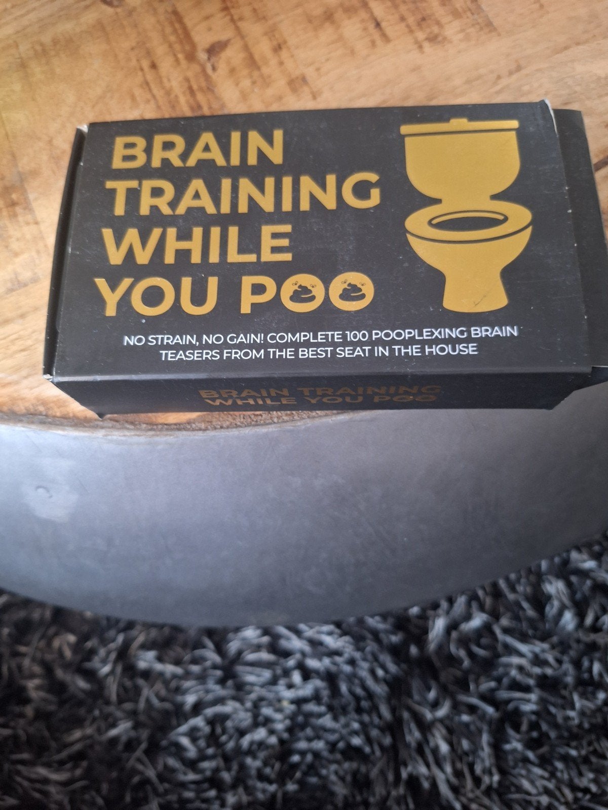 Brain Training While You Poo - Puzzelboek, Ophalen of Verzenden, Zo goed als nieuw, Puzzelboek