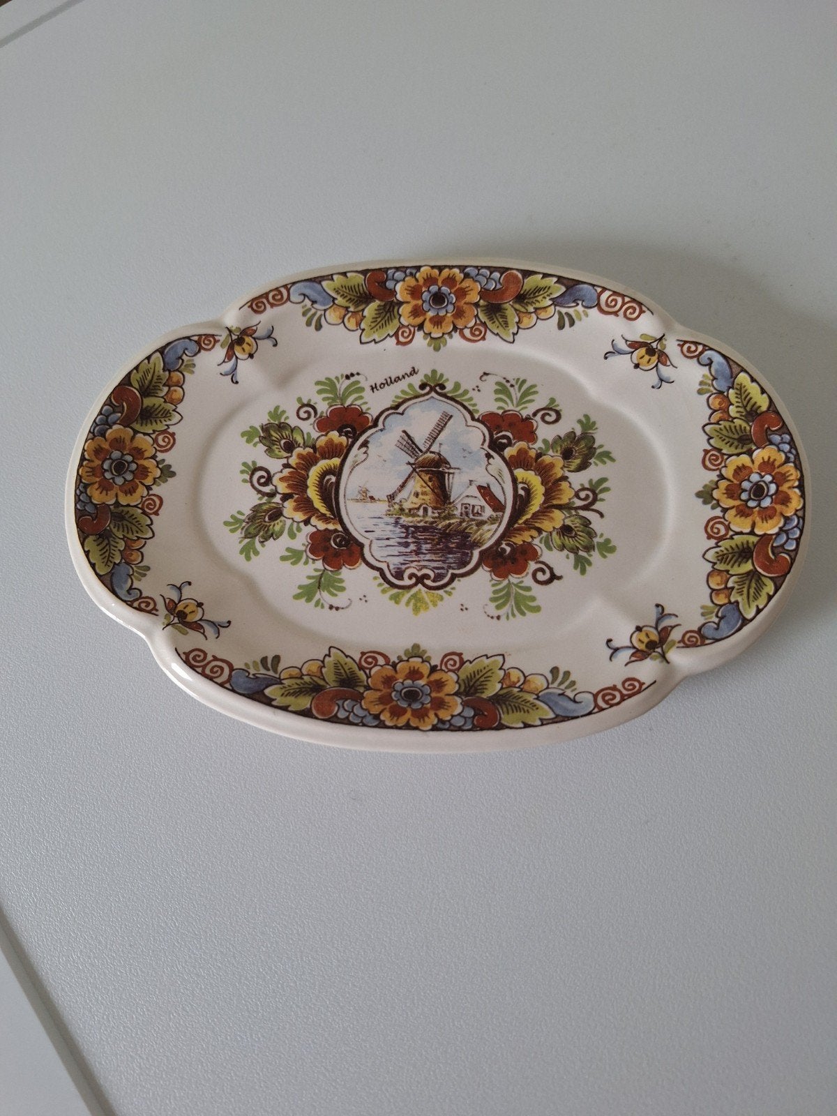porseleinen wandbordje, Ophalen