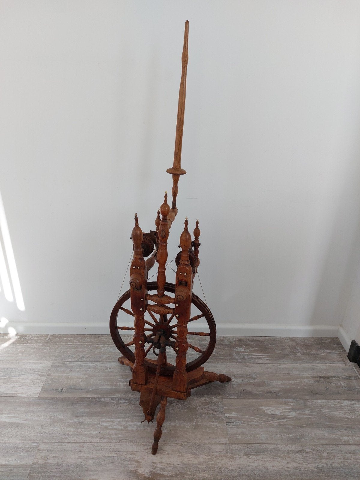 Antiek spinnewiel, Ophalen