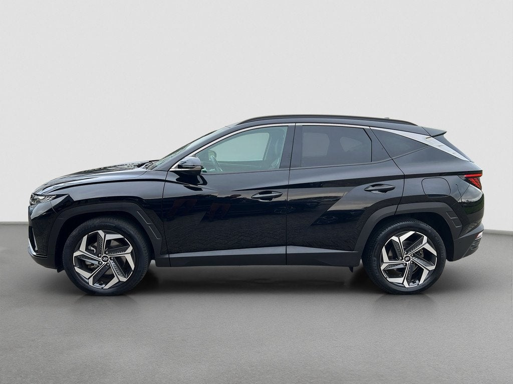 Hyundai Tucson 1.6 T-GDI 265pk PHEV Premium 4WD, Gebruikt, 4 cilinders, Zwart, Bedrijf