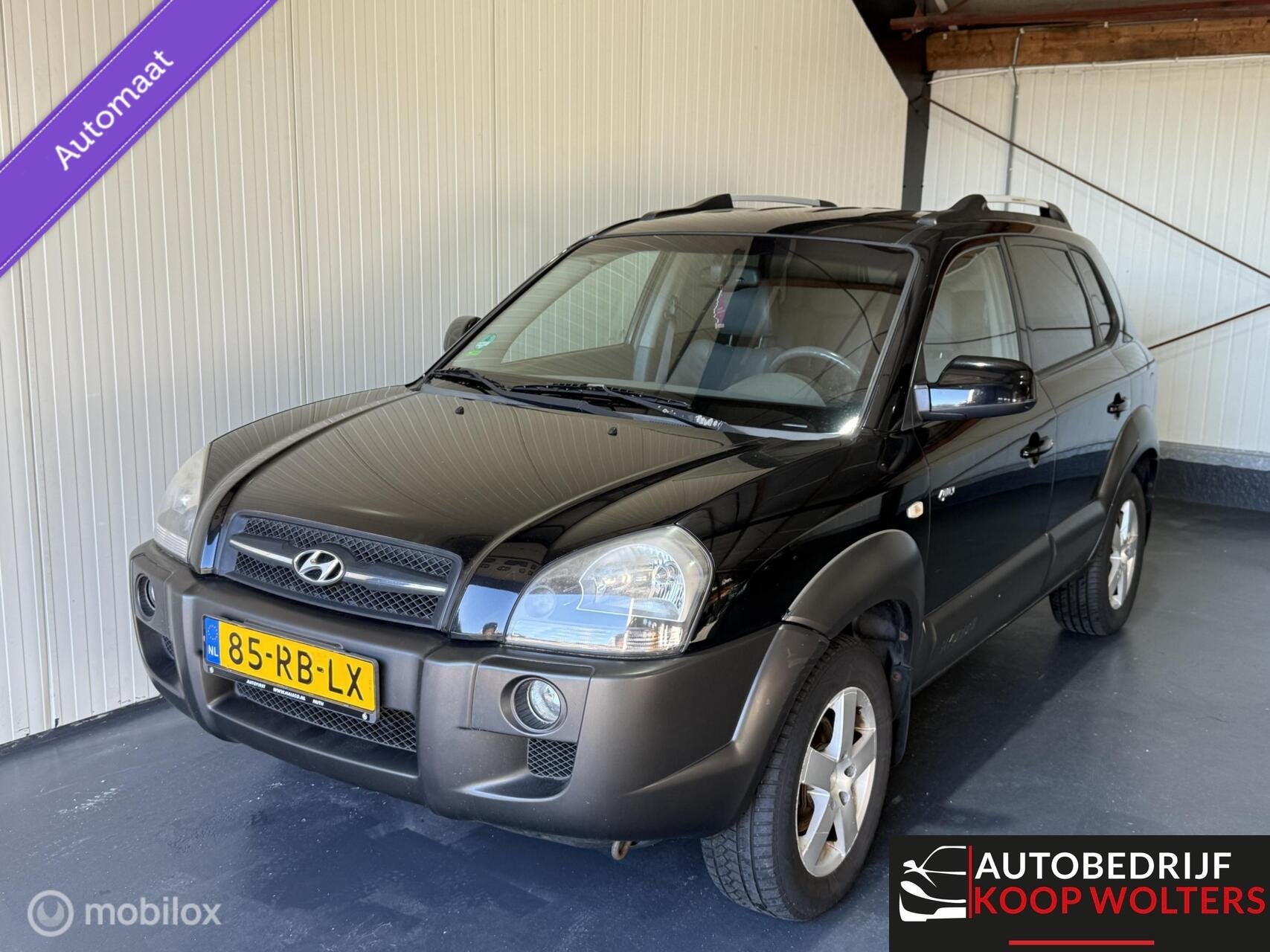 Hyundai Tucson 2.7i V6 4WD Style Automaat, Auto's, Automaat, Gebruikt, 2656 cc, Zwart