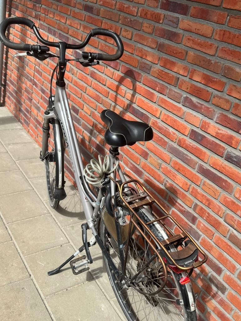 Koga damesfiets met vlinderstuur, framehoogte 59, Fietsen en Brommers, Fietsen | Dames | Damesfietsen, Gebruikt, Velgrem, Versnellingen