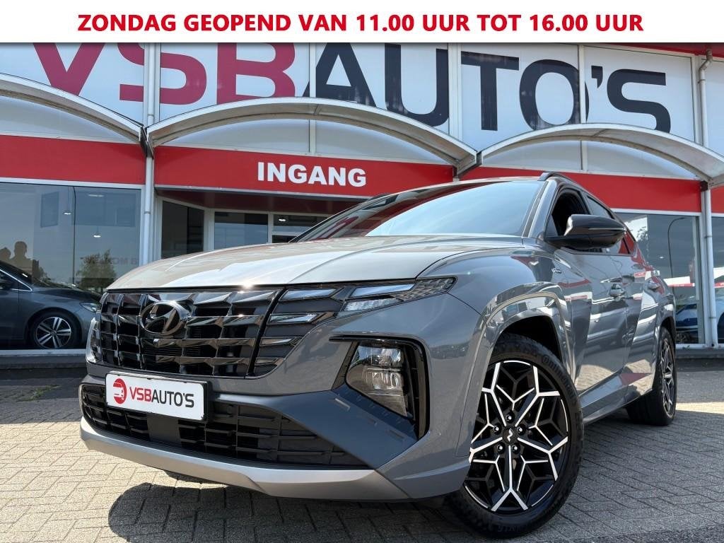 Hyundai TUCSON 1.6 T-GDI MHEV N-LINE 180PK NARDO-GREY NAVI C, Auto's, Gebruikt, Huisgarantie, Met garantie (alle), Leder