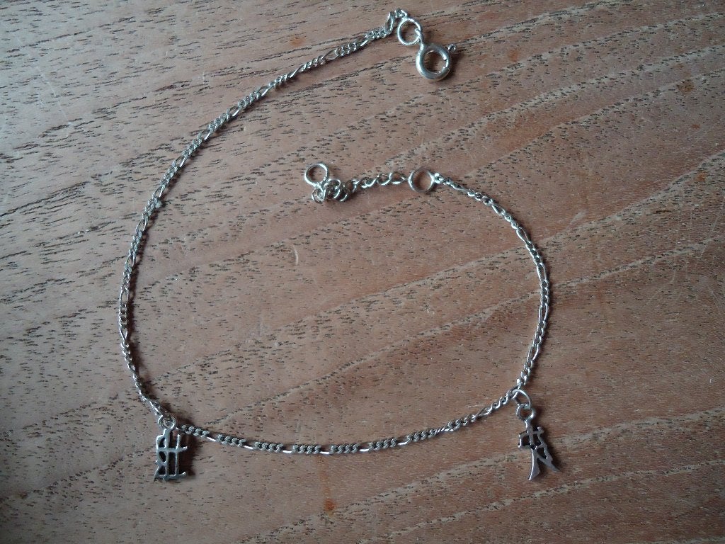echt zilveren enkelbandje met 2 zilveren chinese tekentjes, Ophalen of Verzenden, Zo goed als nieuw, Zilver
