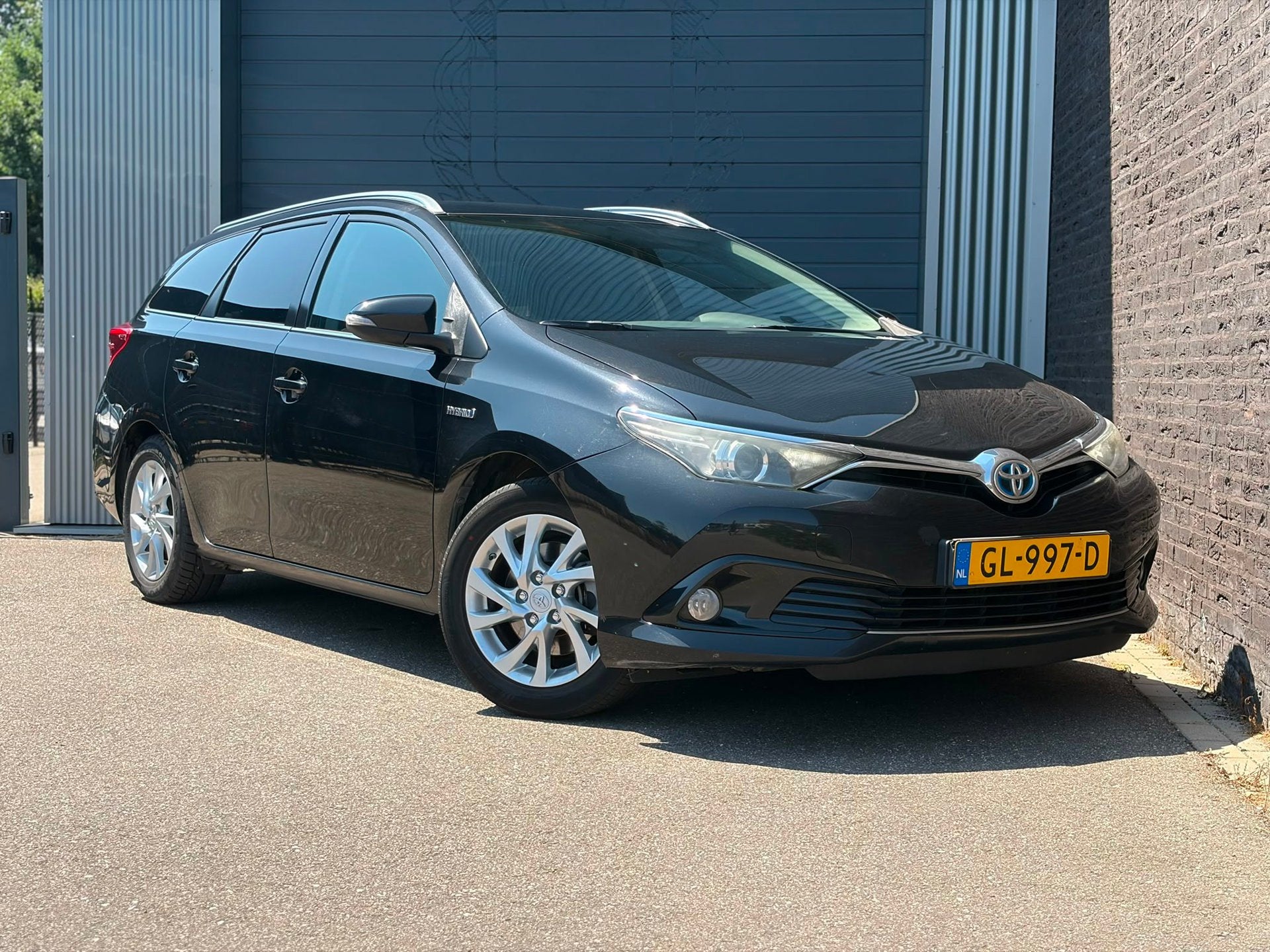 Toyota Auris Touring Sports 1.8 Hybrid Lease Automaat|Camera, Stof, Gebruikt, Euro 6, Zwart