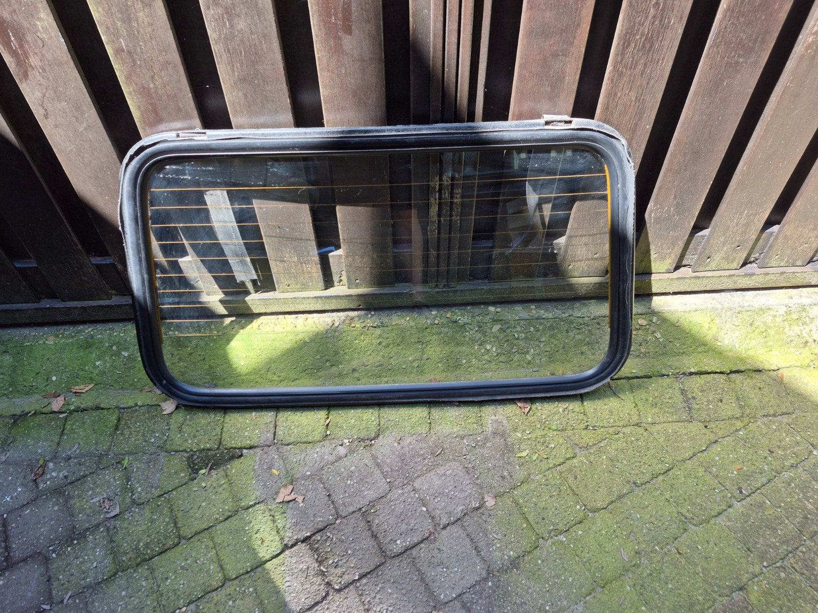 Achterruit met verwarming en rubber, Ophalen
