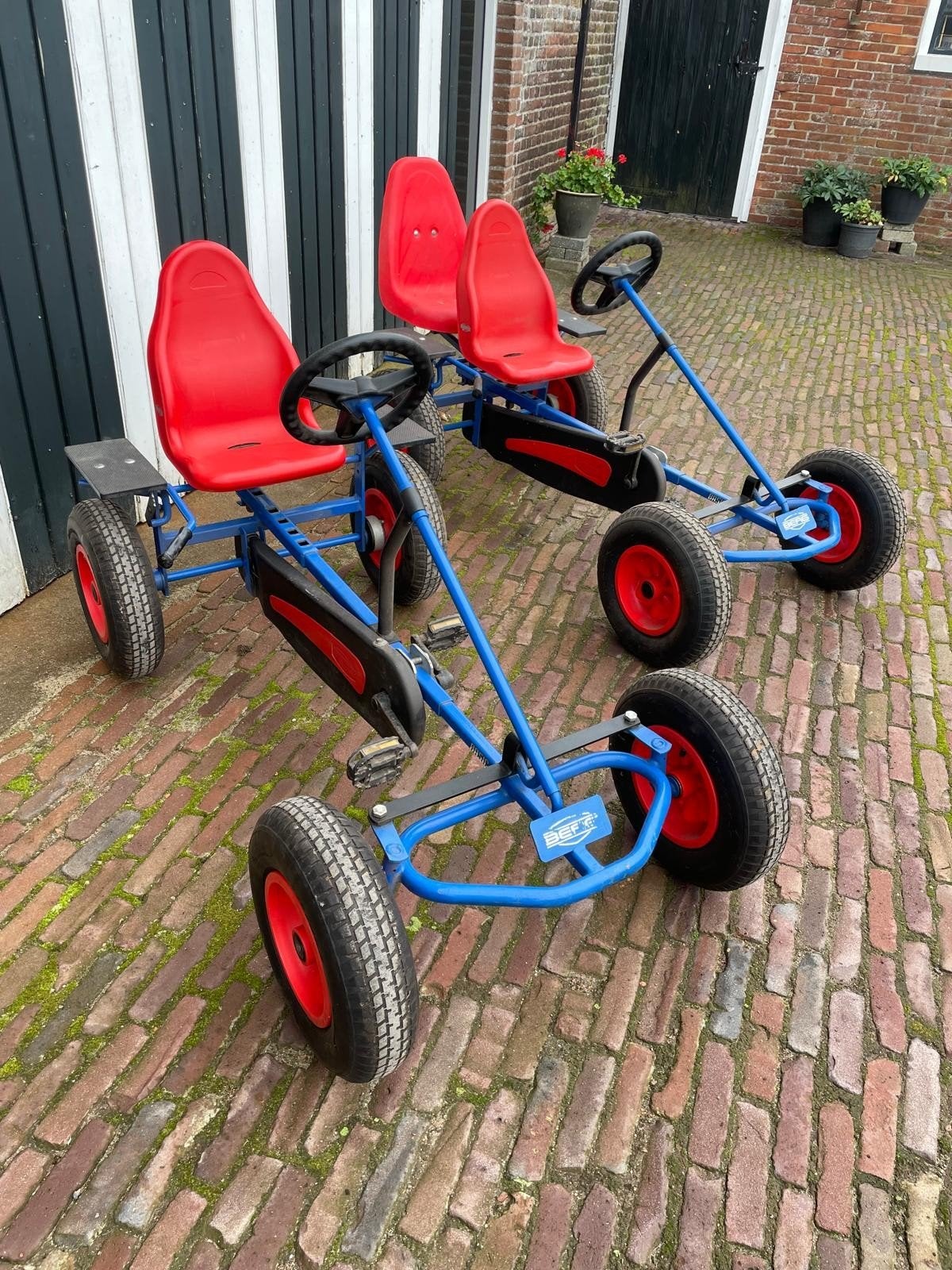 Twee BERG skelters met duozitje - Blauw/Rood, Ophalen, Gebruikt, Trapvoertuig