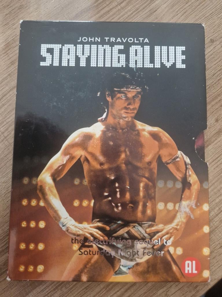 Staying alive , 1983 , John travolta, Alle leeftijden, Ophalen of Verzenden, Zo goed als nieuw, Actie en Avontuur