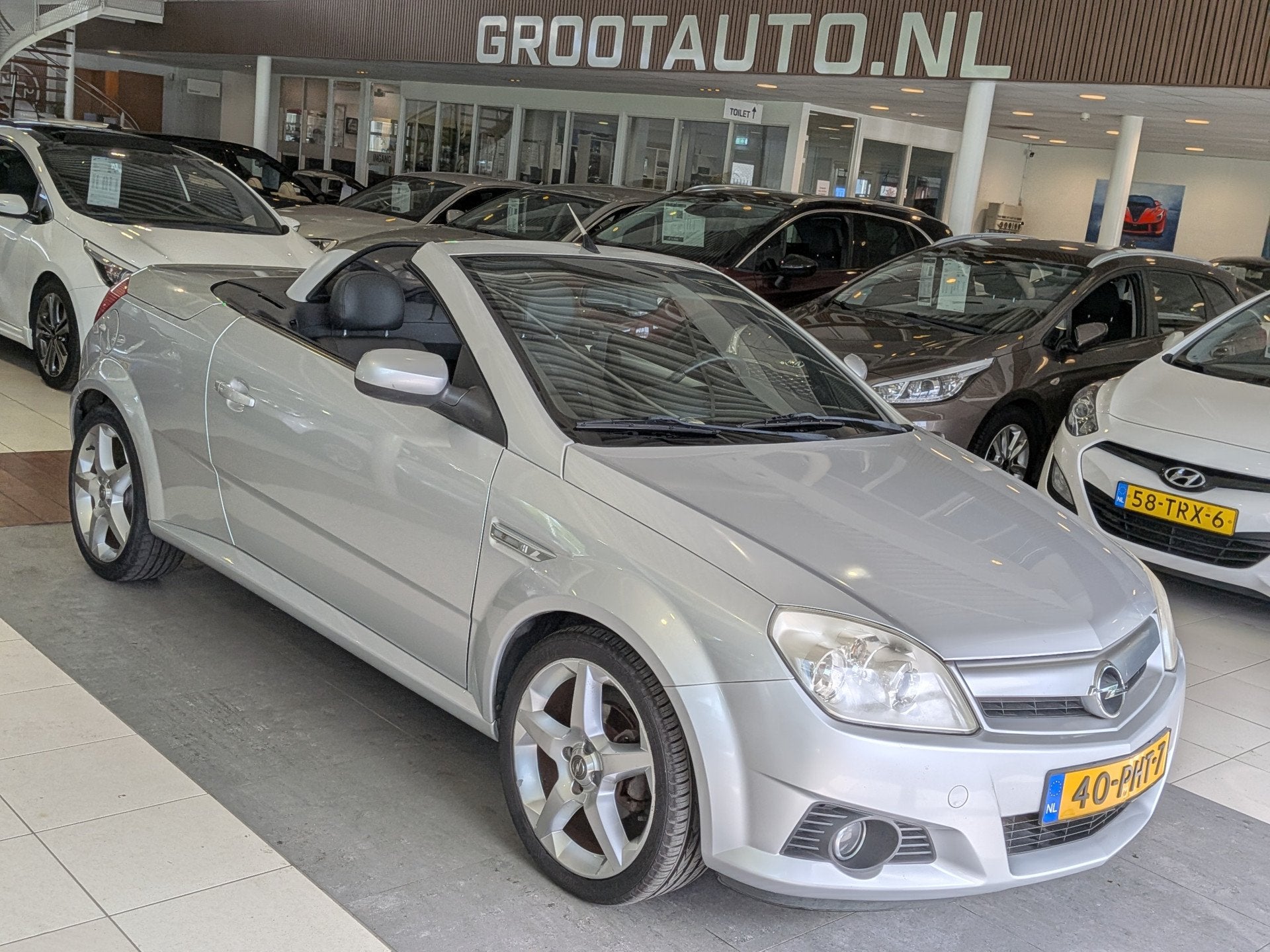 Opel Tigra TwinTop 1.8-16V Linea Rosso Airco, Stuurbekrachti, Auto's, Gebruikt, Zwart, 4 cilinders, 1796 cc