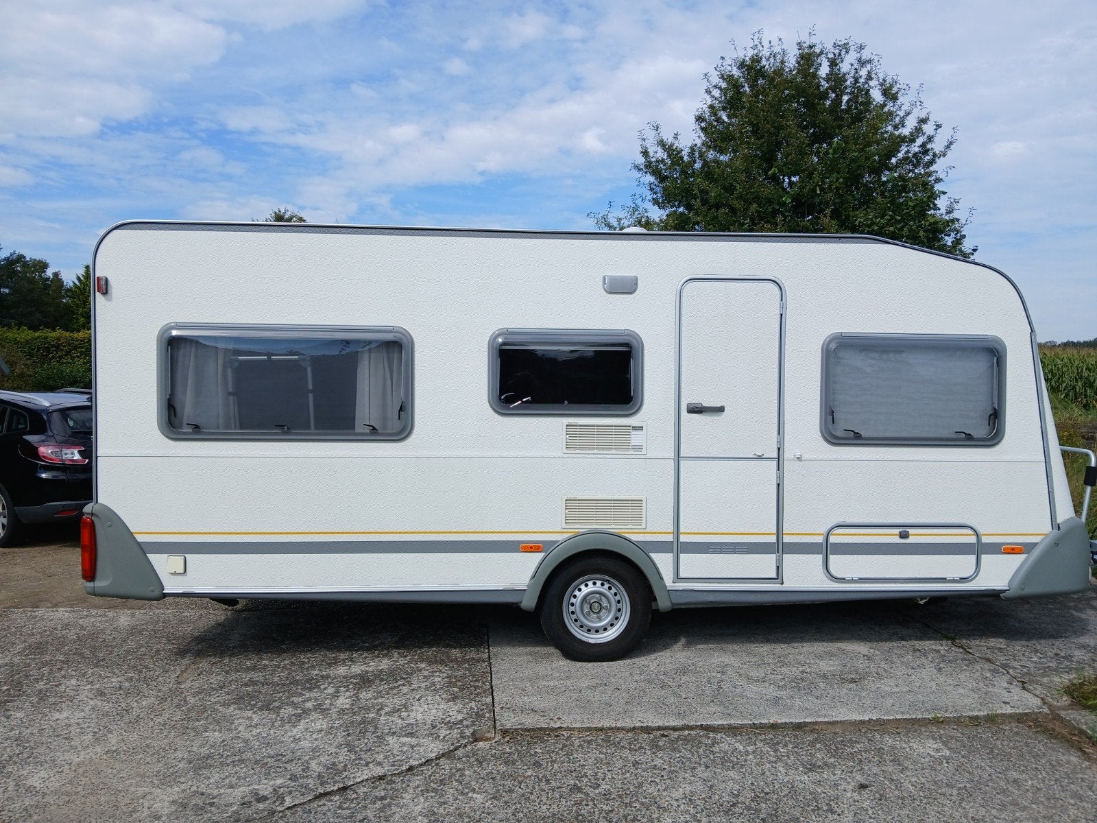 Knaus Sudwind 500 TK (2001) - 5 pers met Isabella voortent, Caravans en Kamperen, Omvormbare zithoek, Rondzit, Particulier, Kachel