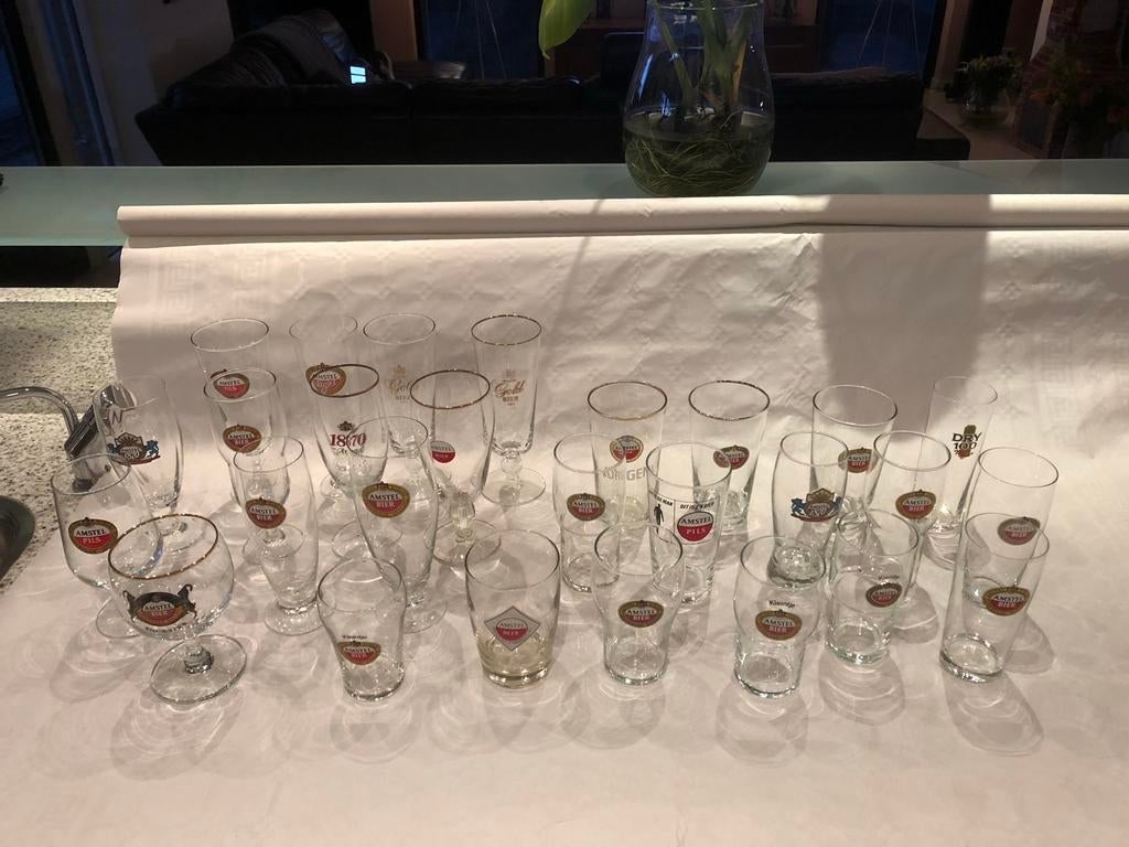 Grote verzameling Amstel bierglazen (25 stuks), Verzamelen, Ophalen of Verzenden, Gebruikt, Glas of Glazen, Amstel